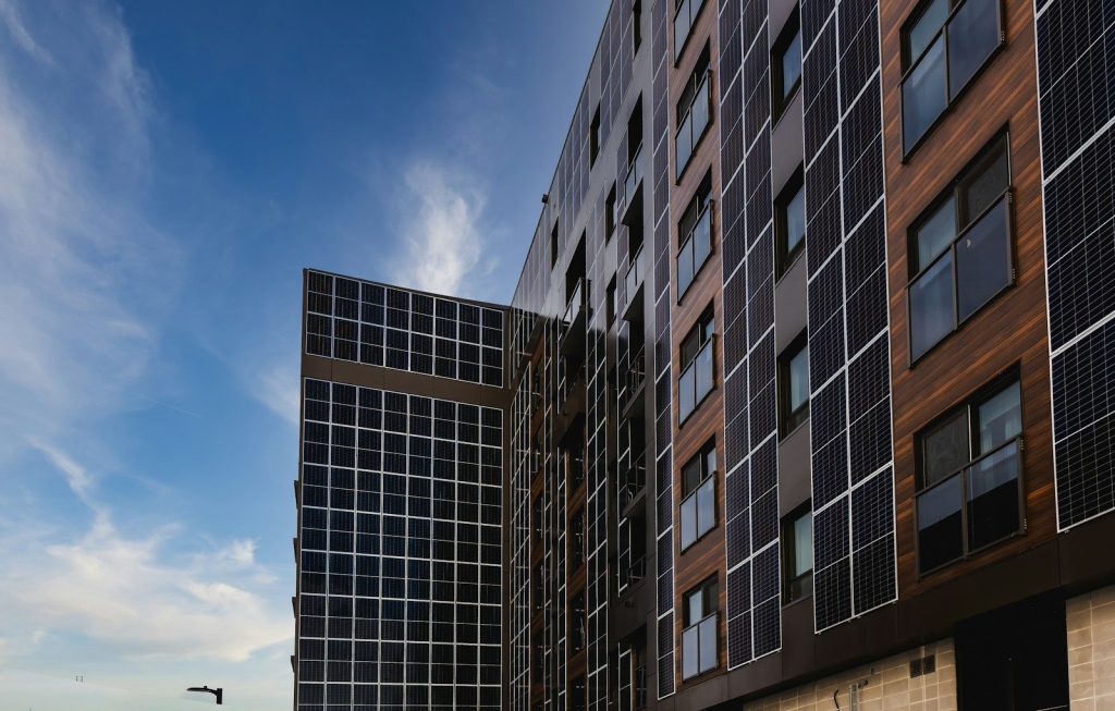 Modern building facade with solar panels and windows