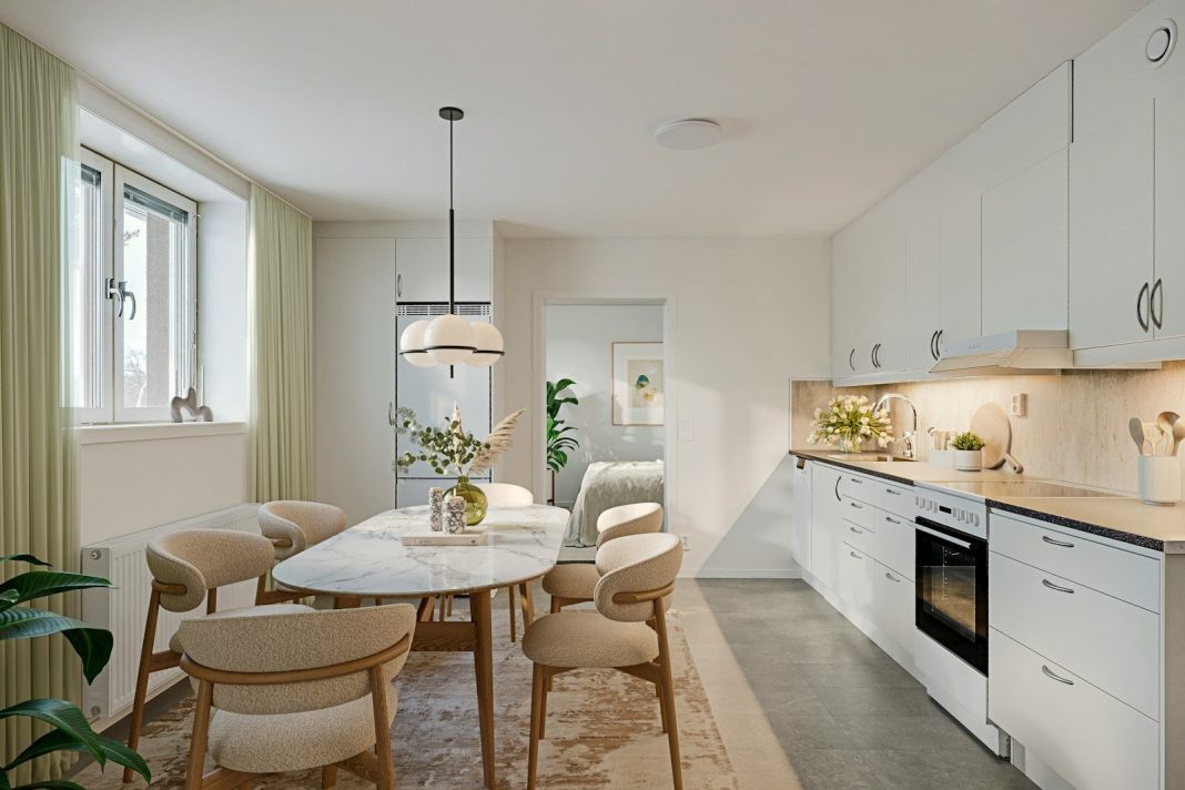 A 3D render of a modern kitchen and dining area with white cabinets and an oval marble table
